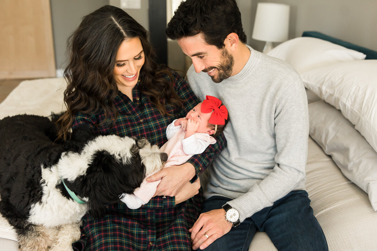 Scottsdale newborn photographer captures mom and dad holding newborn baby