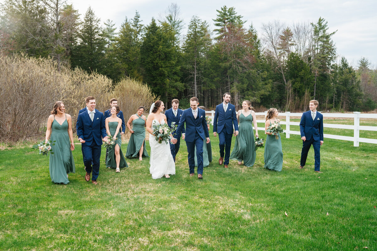 Bride and groom laughing together during wedding day portraits