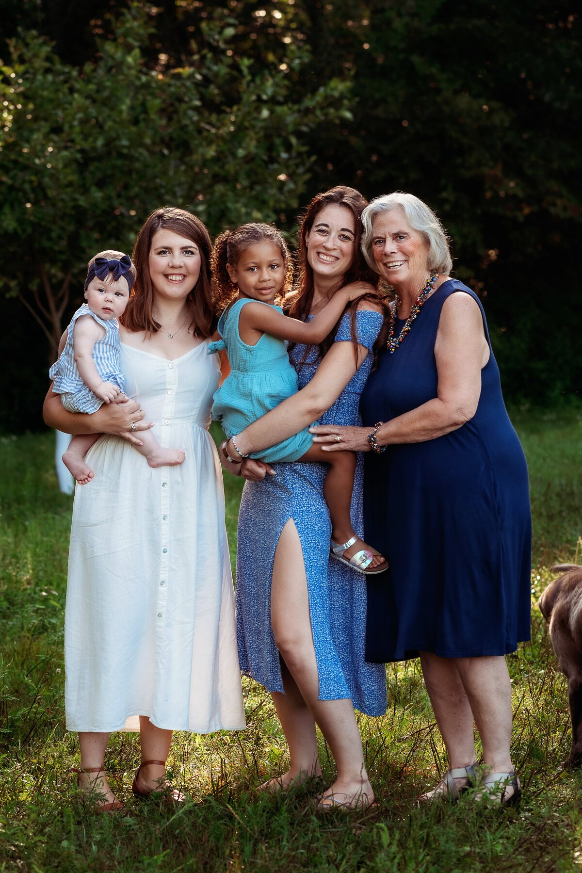 Three generations, moms with their babies and grandma