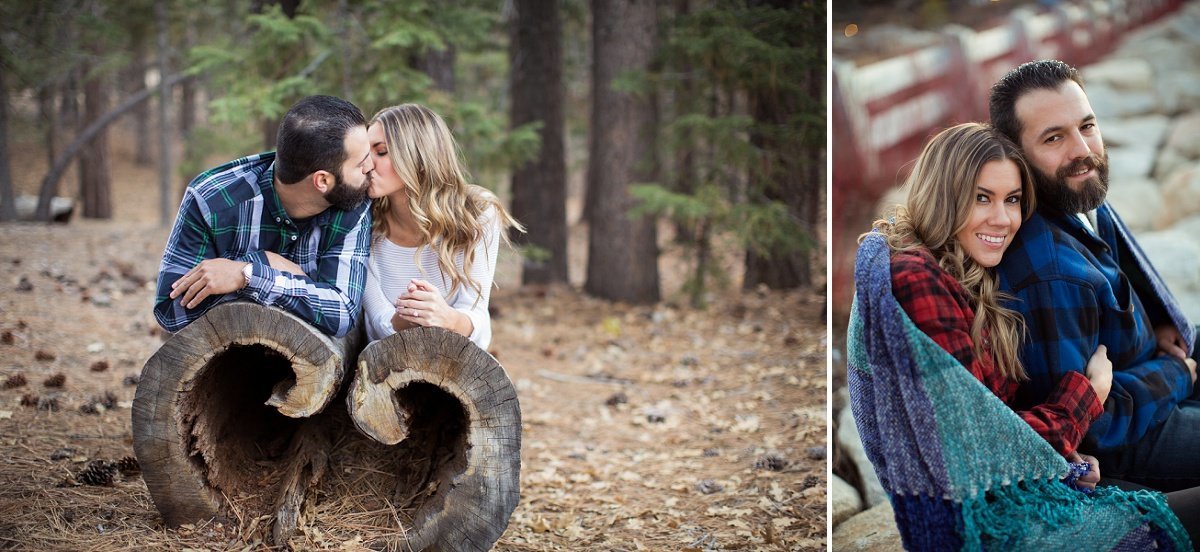 Engaged couple share a kiss  while laying on a log and then cuddle up under a blanket during the winter cold in Big Bear