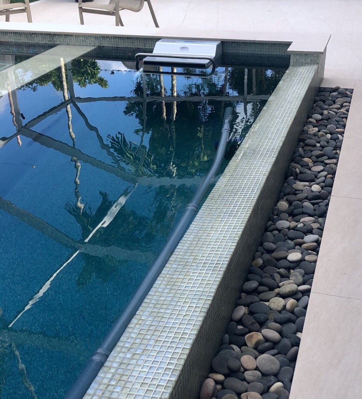 Pool ledge with rocks and swim current machine