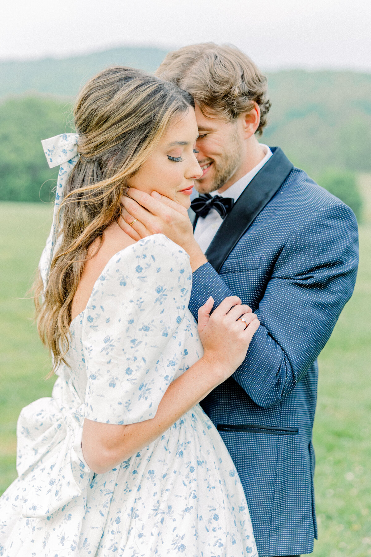 Groom nuzzling bride, editorial inspired image at the ivy rose barn