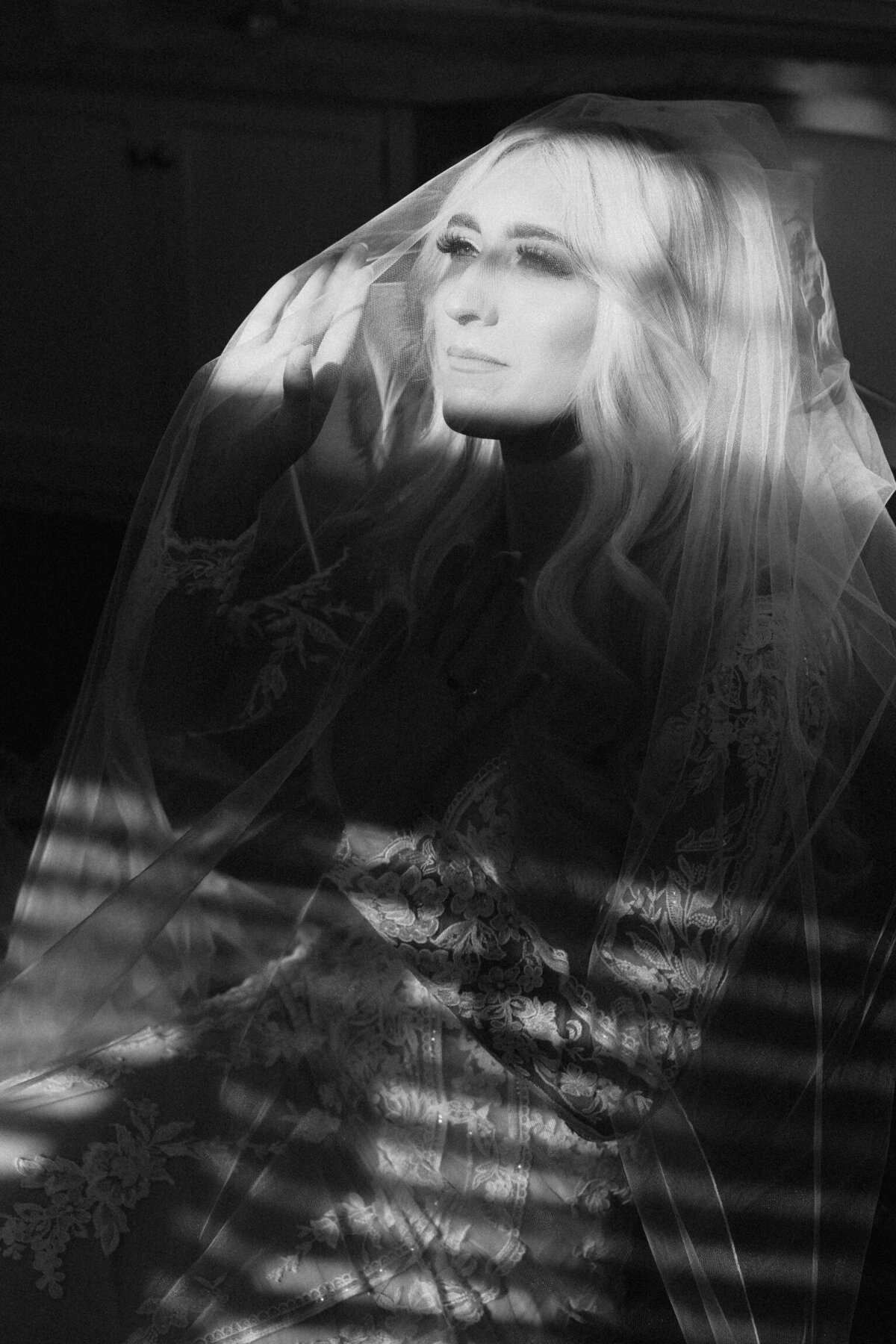 bride portrait in bathroom at Crispin Hill in lace wedding gown