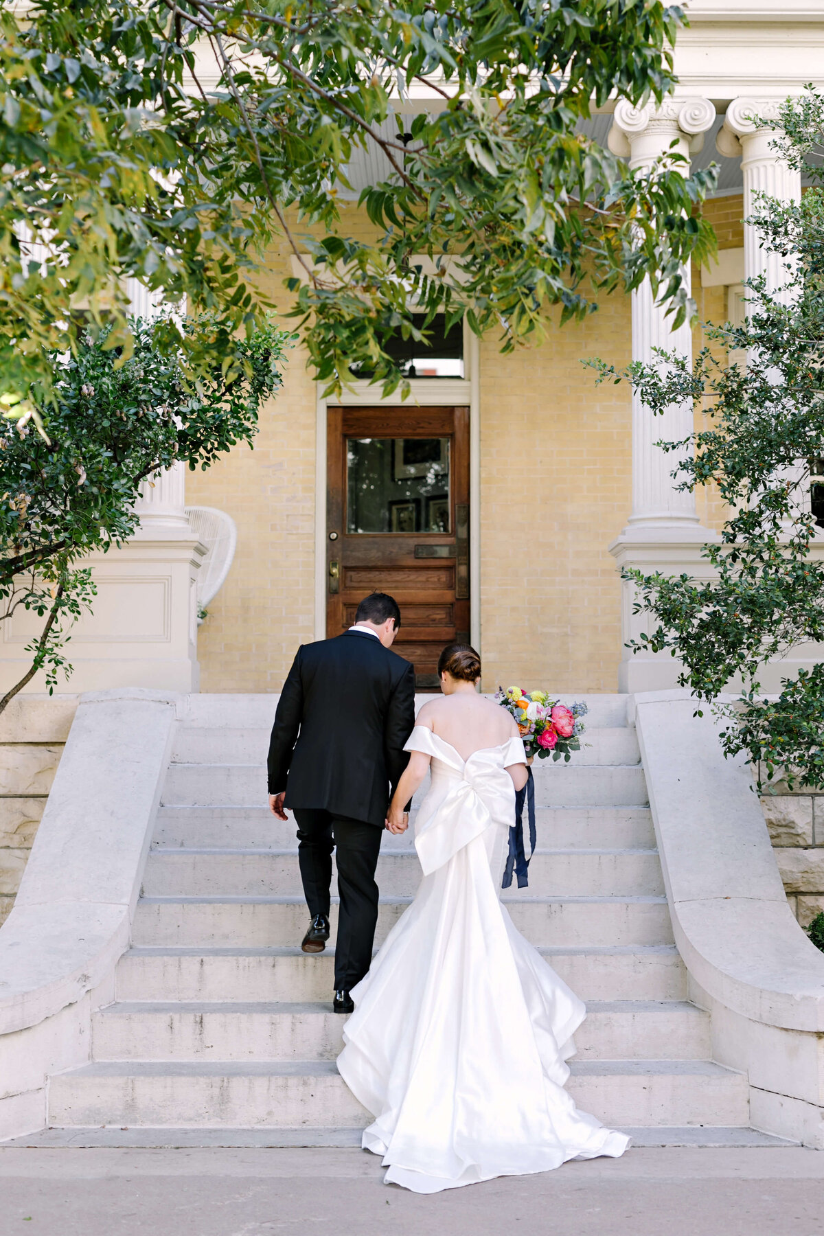 Couples portraits outside of Hotel Ella