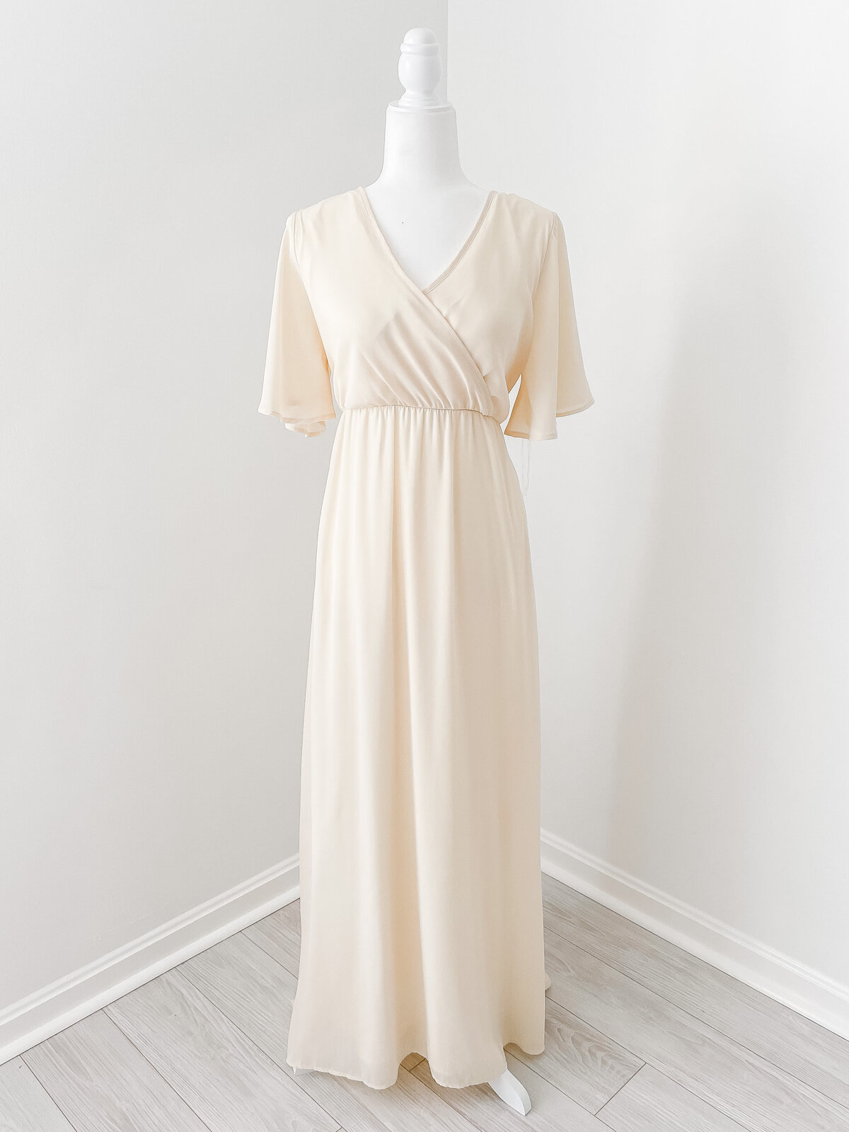 A maxi pale yellow and cream dress  with short sleeves for a DC Newborn Photography photo session