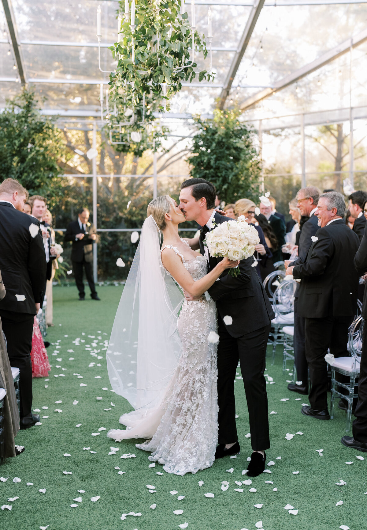 Bride and groom first kiss at their Dallas wedding ceremony
