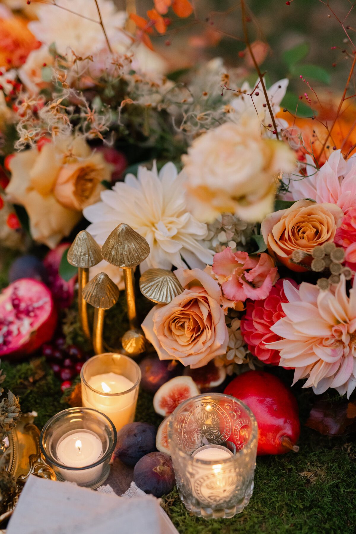 Close up of three candles and flowers
