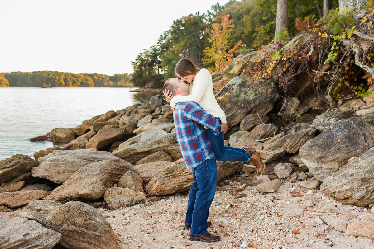 couple at lake lanier rocks in the fall