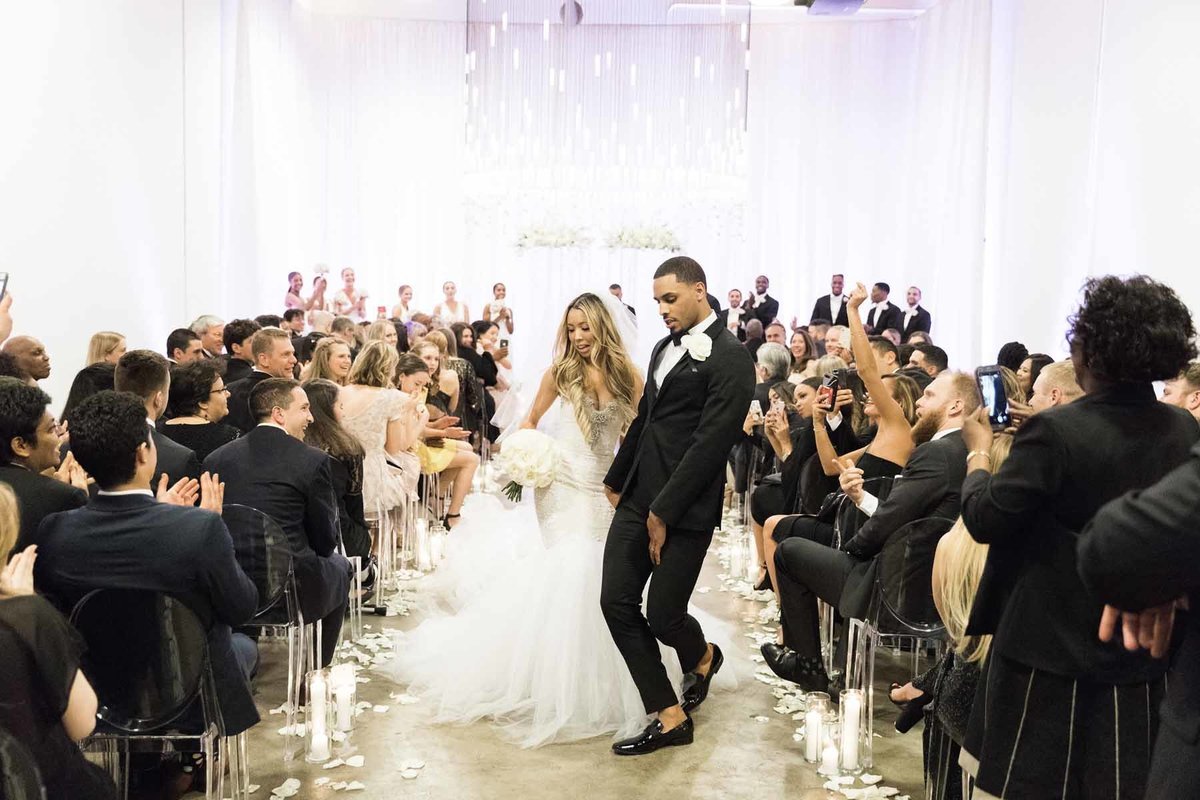 What joy these two have dancing down the aisle of their wedding ceremony