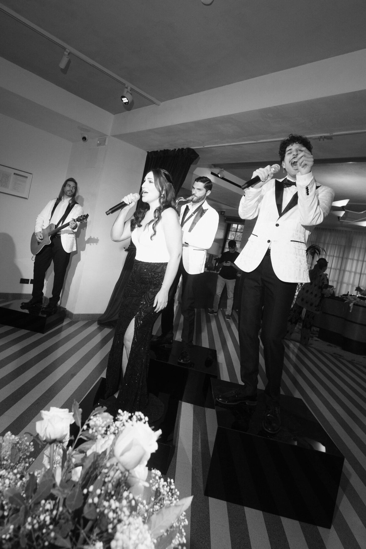 Live wedding band performing with saxophone and vocals at Soho House Rome
