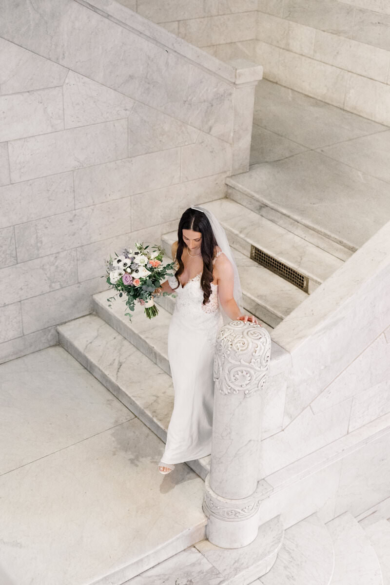 bride walking down stairs taken by wedding photography minneapolis