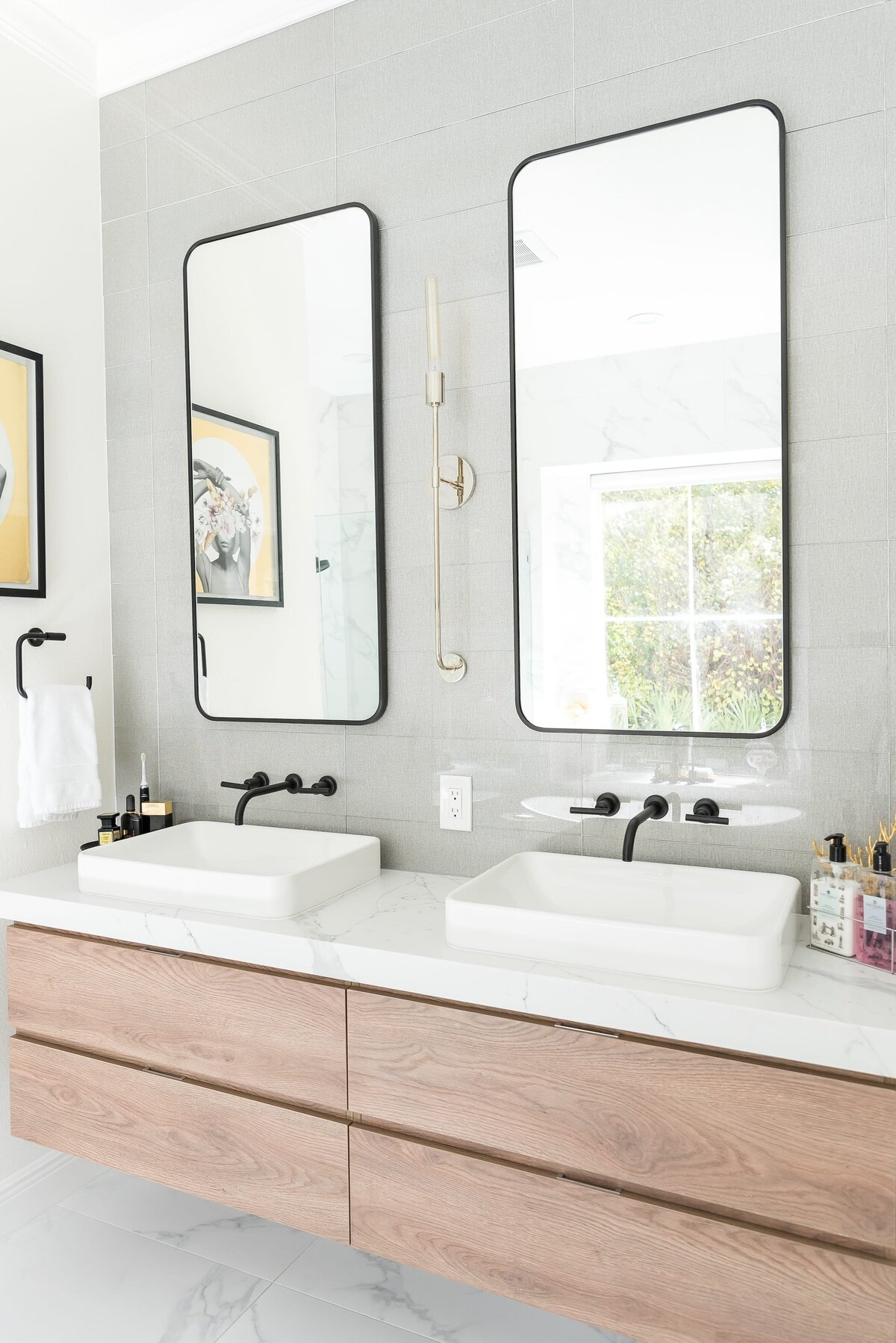 dewine design orlando interior designer modern lakehouse bathroom with black framed mirrors and double sinks