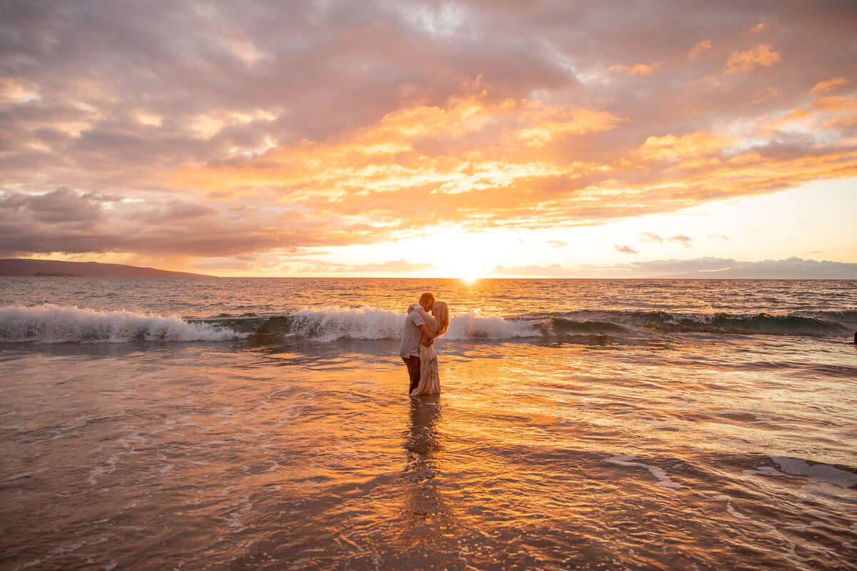 Maui Elopement Photographer captures bride and groom in water during beach elopement