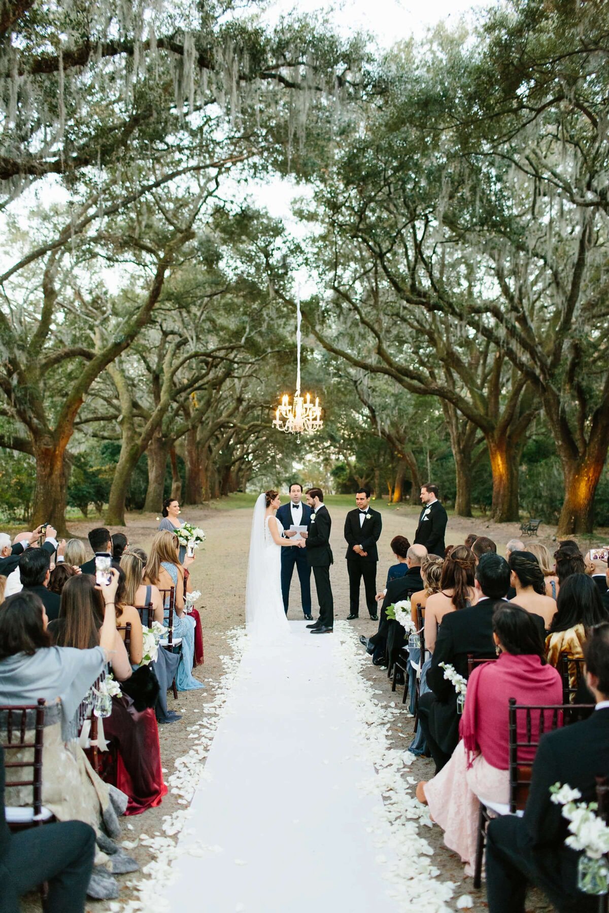 outdoor wedding ceremony under the oaks