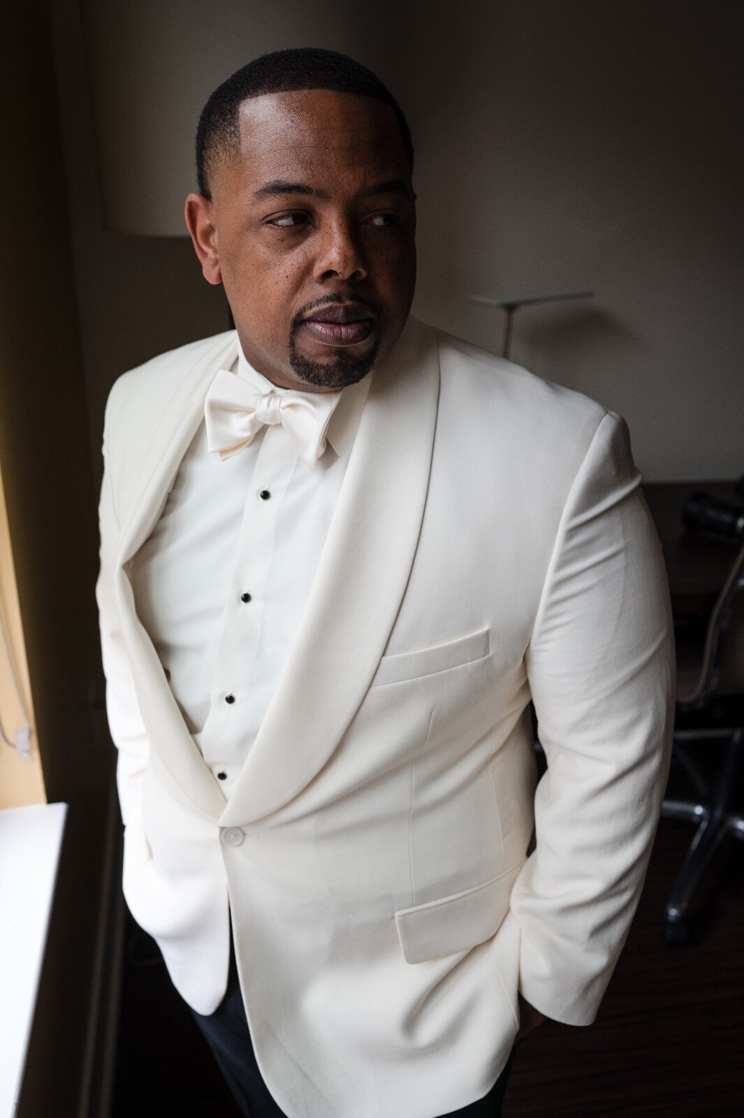 groom-tux-window-portrait-alexander-hotel.jpg