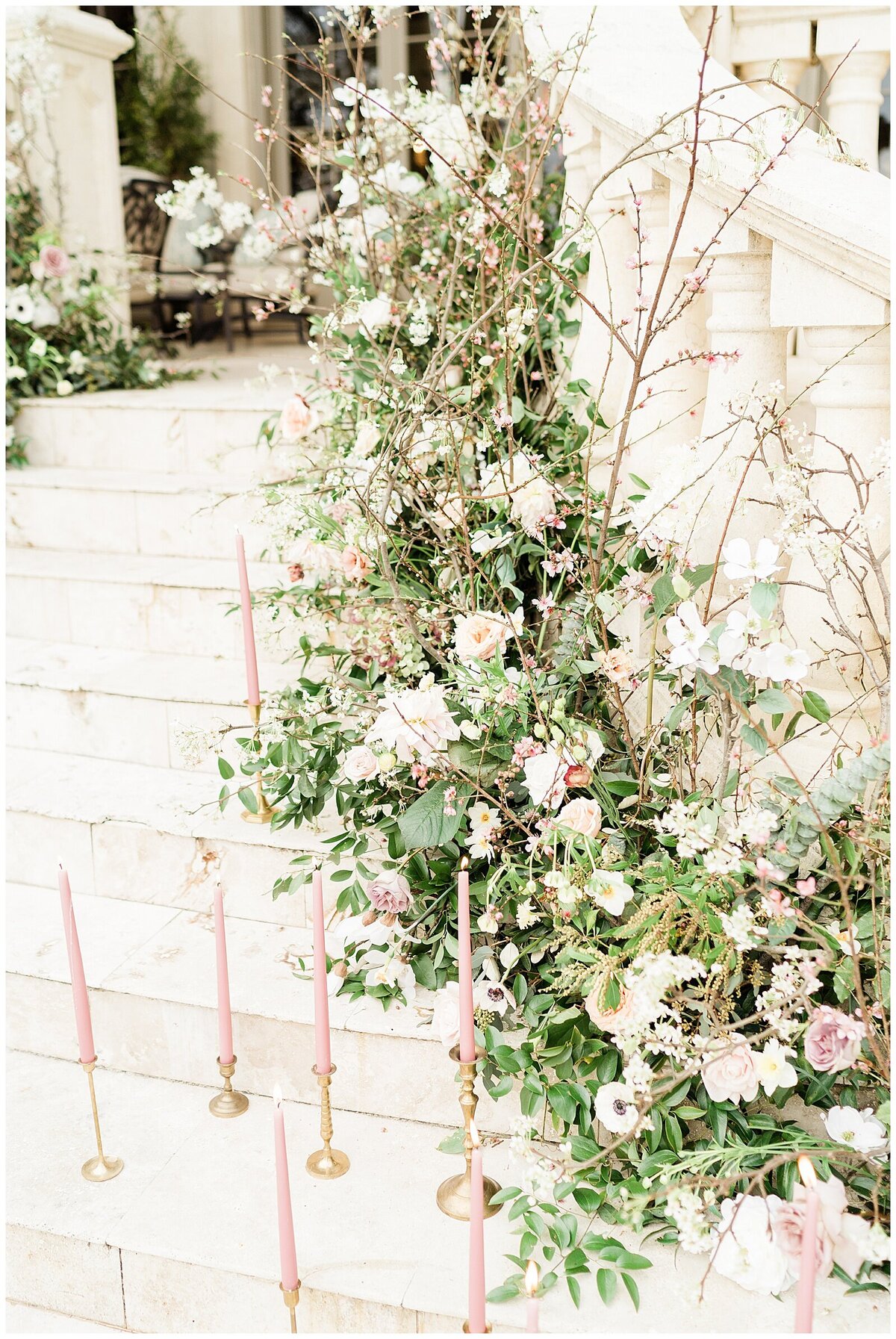 Flowers lining white steps