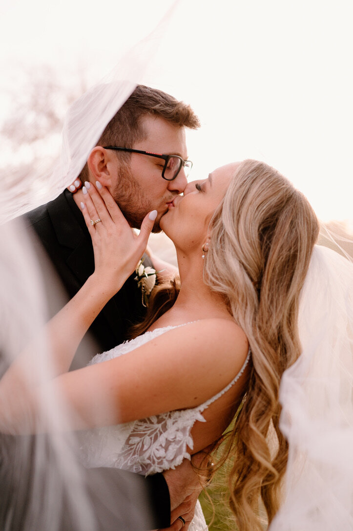 bride and groom kissing