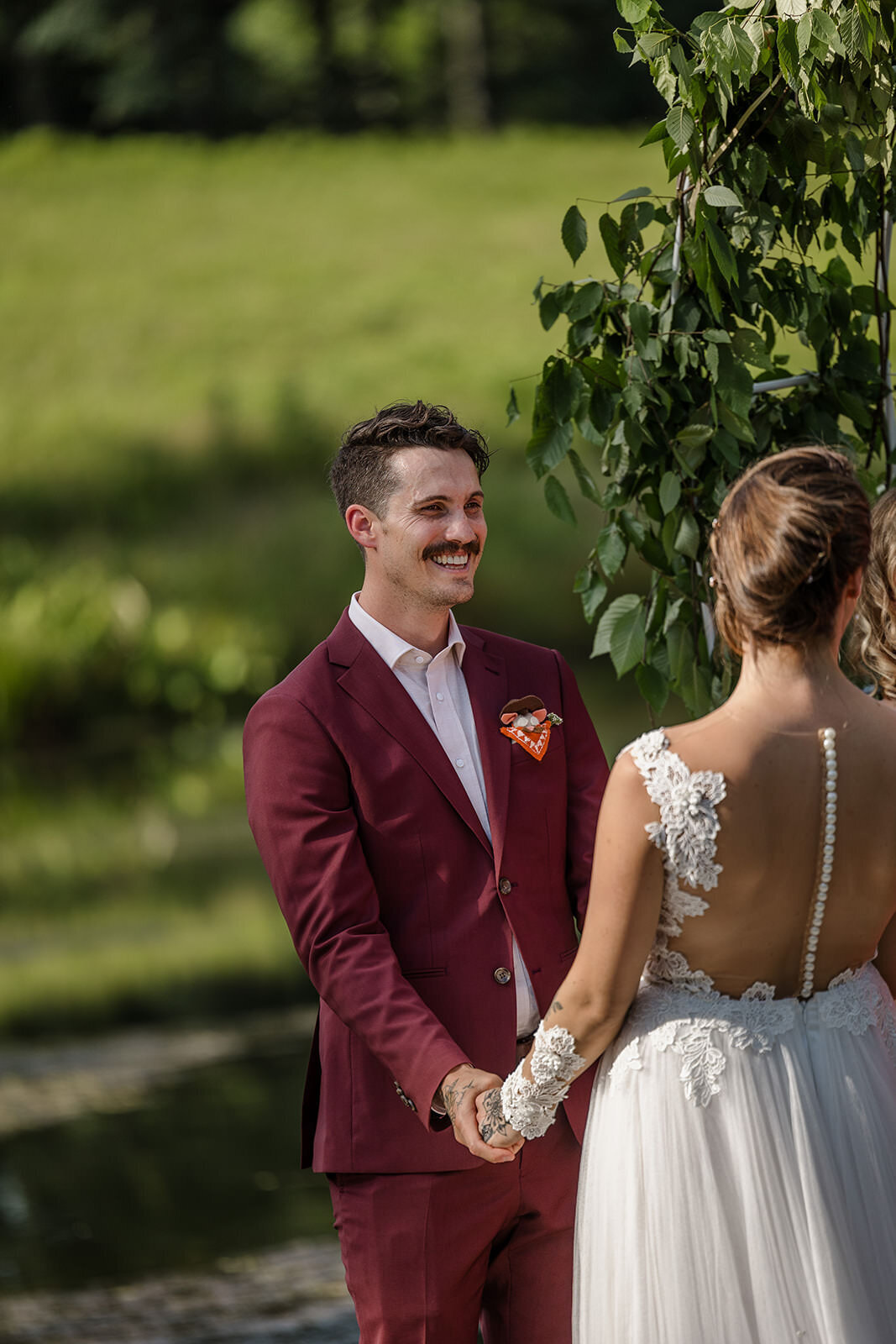 A person smiling at their partner during their wedding ceremony