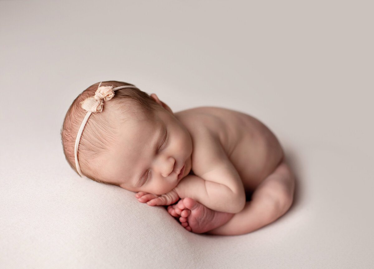 simple newborn posing in loveland colorado photography studio