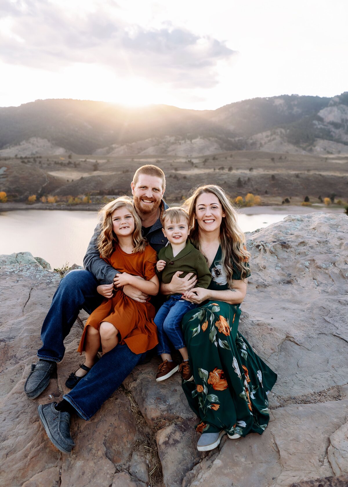 parents cuddled up with their kids at horsetooth