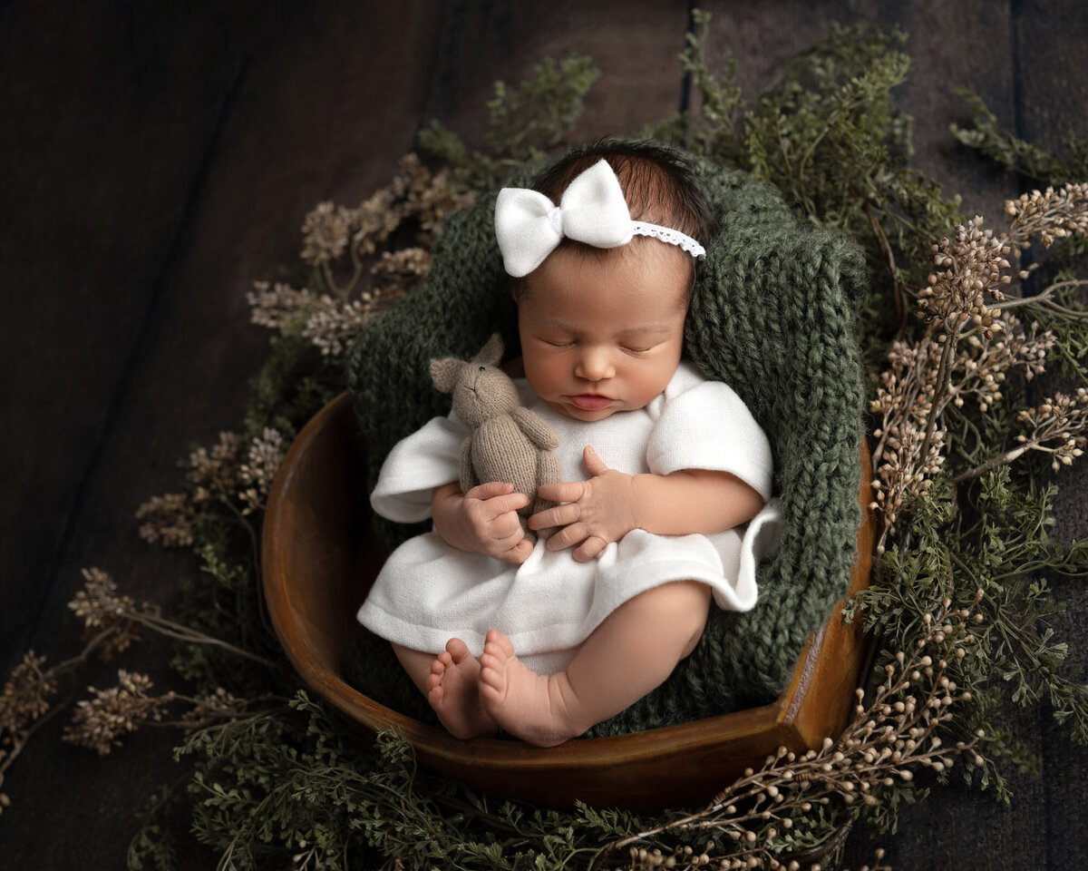 Newborn baby white outfit wooden bowl Liberty Hill outdoor photographer