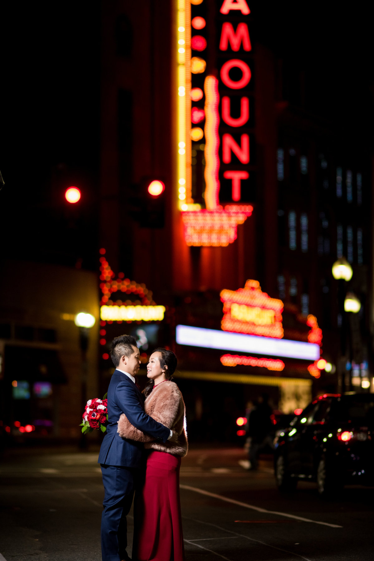 Couple posing in Boston downtown crossing night portrait