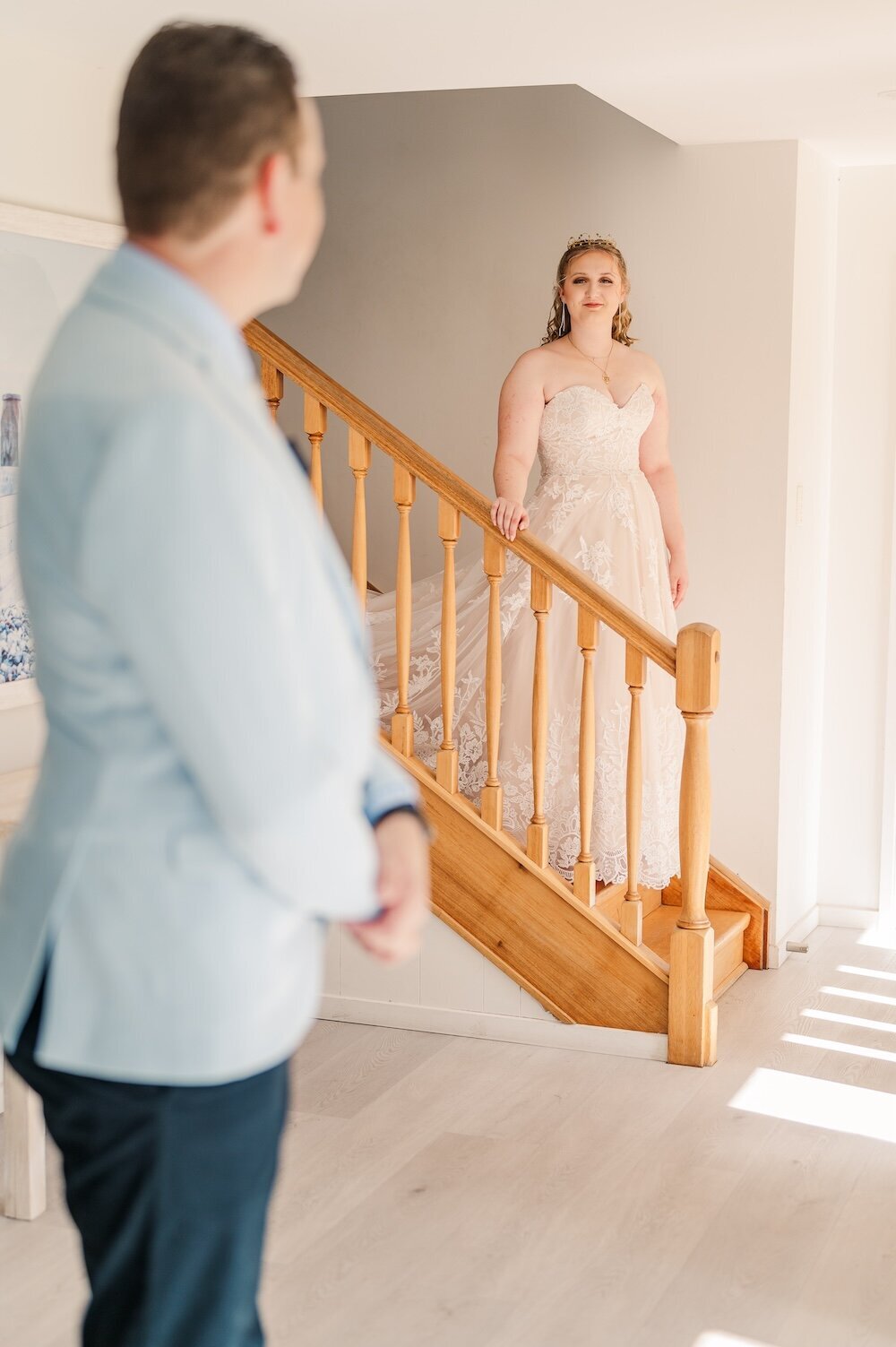 Bride and Father Sharing a first look as the bride comes down the stairs
