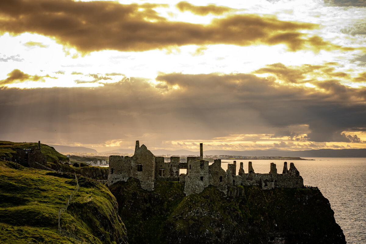 Dunluce Castle at sunset in Northern Ireland.