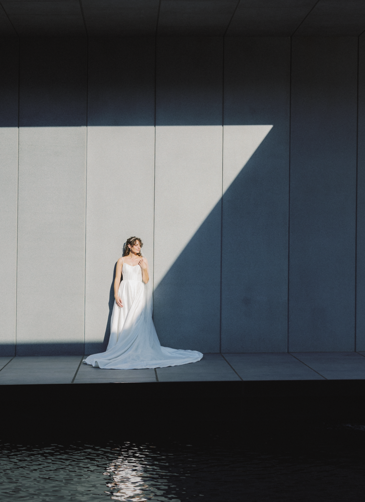 Bride stands by building