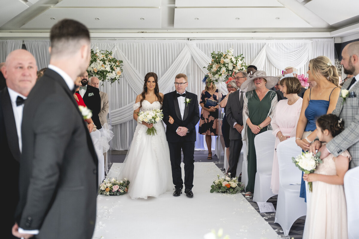 Charlotte's Dad walking her down the aisle