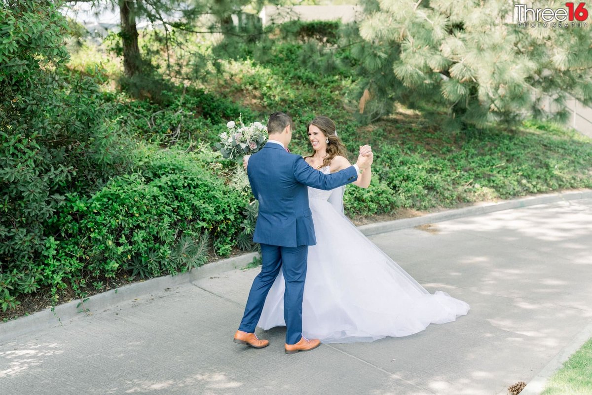 Big smiles between Bride and Groom as they look at each other