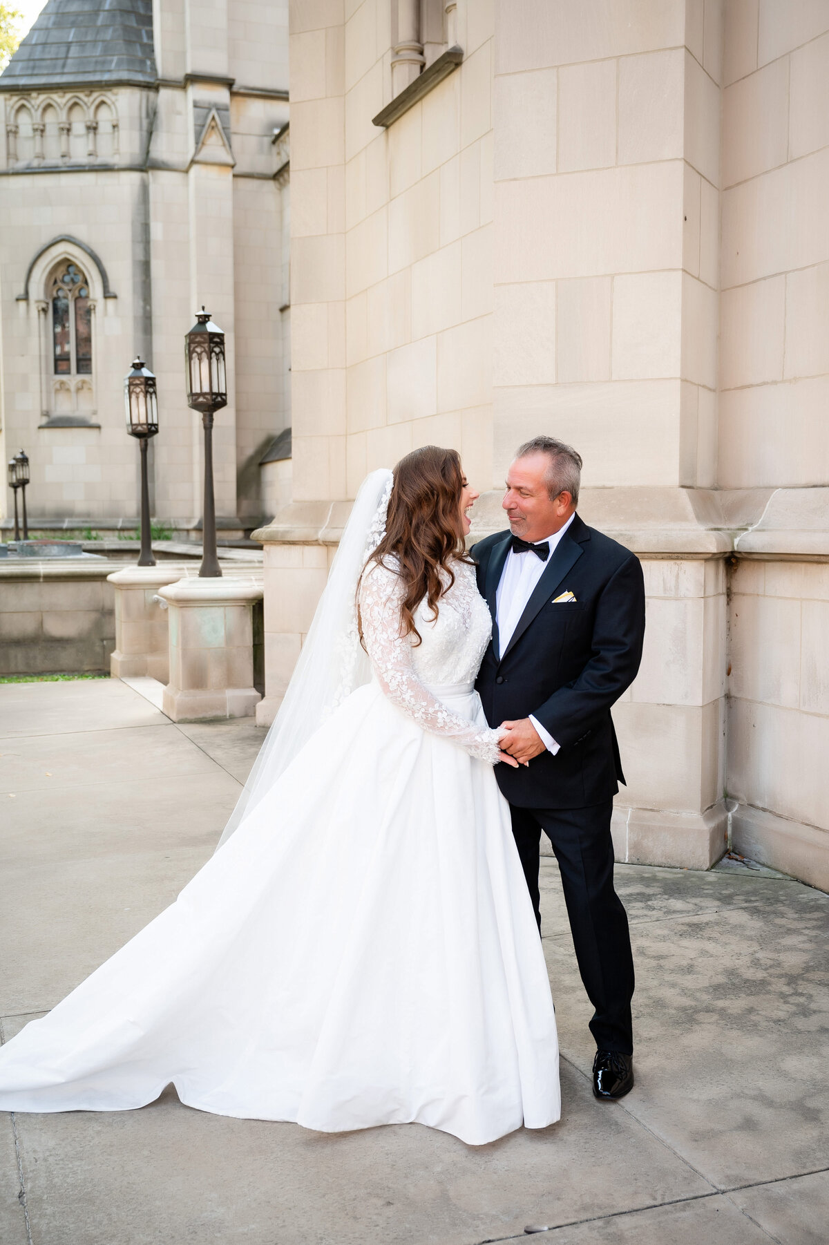 bride smiling with her dad at wedding day