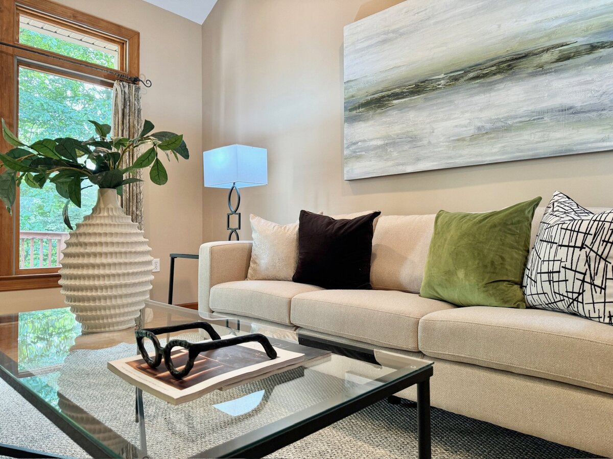 Living room with green, black, and white accents