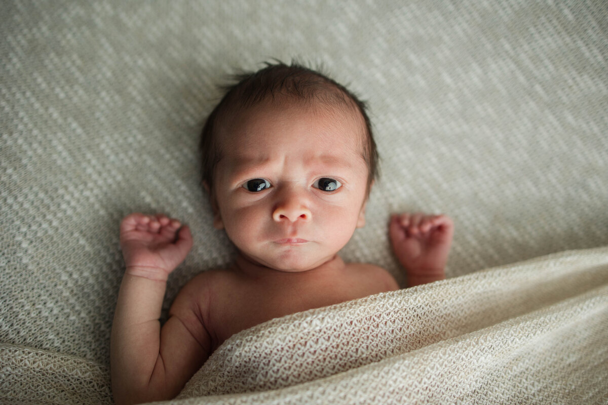 Newborn Baby Boy with Serious Face