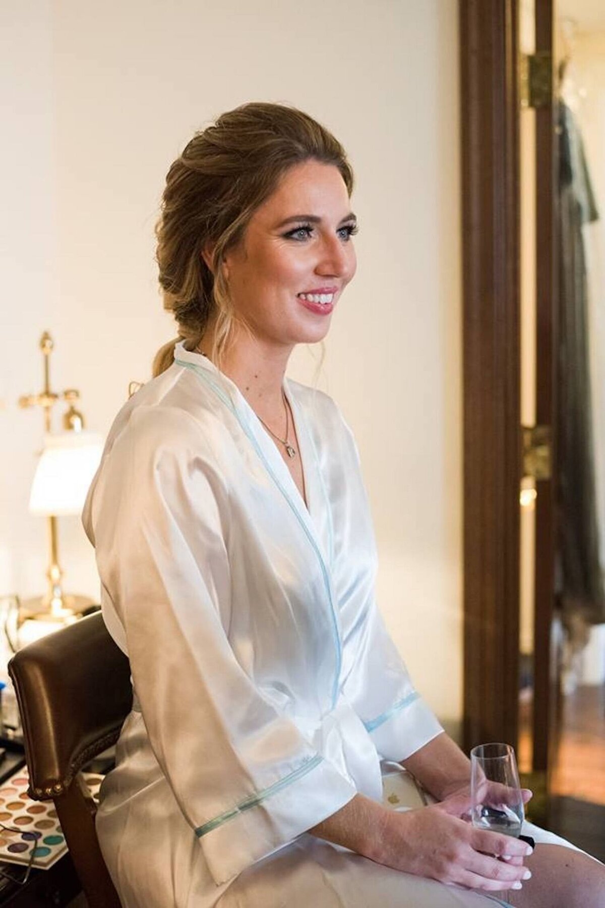 Bride in her getting ready robe at a luxury Italian inspired Chicago North Shore wedding.