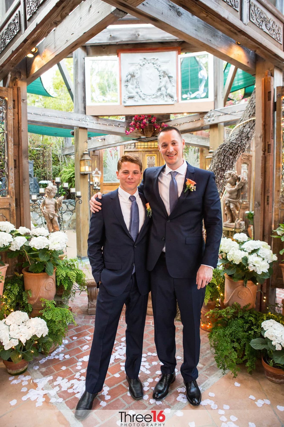 Groom poses with his son prior to his wedding ceremony