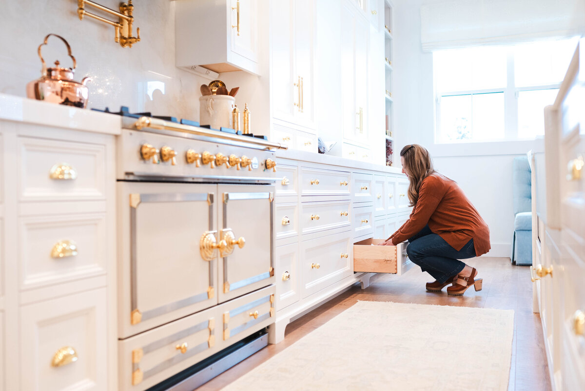 woman packing items in a box for moving