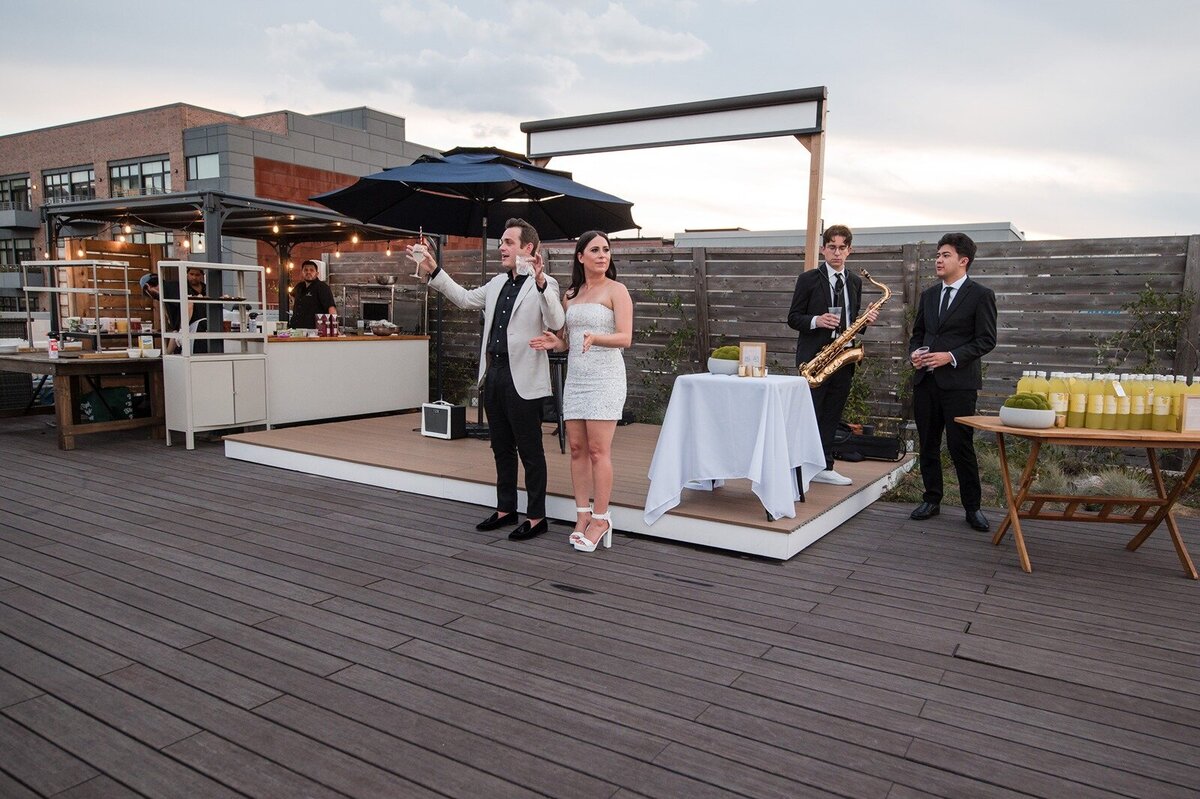 HT-Engagement-Rooftop-Hoboken- Deanna & Jerry toast(201)