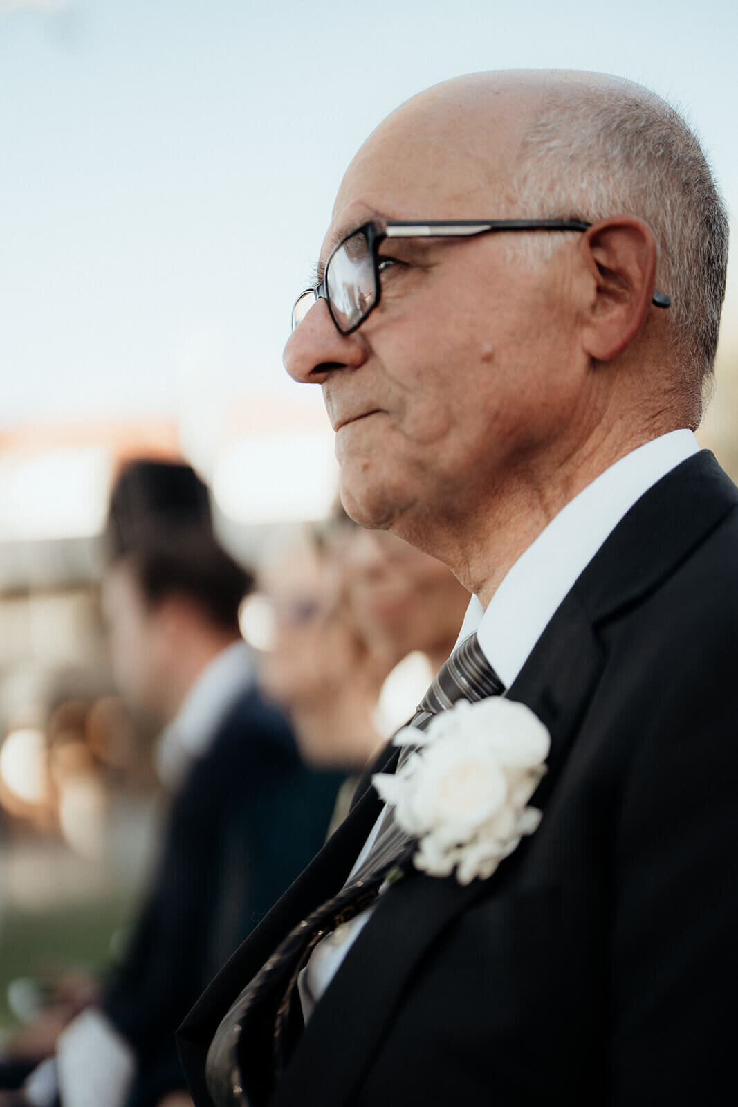 Father of the bride watching the ceremony