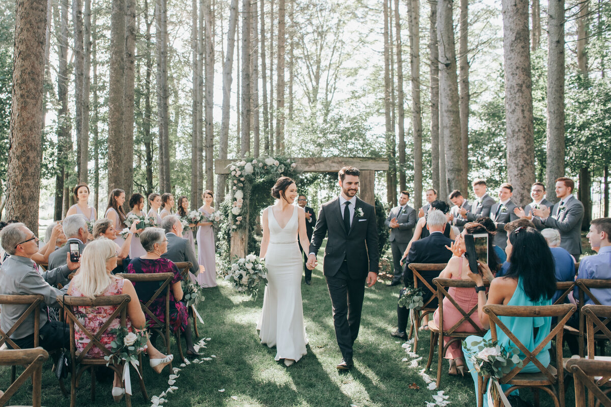 Bride and groom saying their vows in an enchanted forest