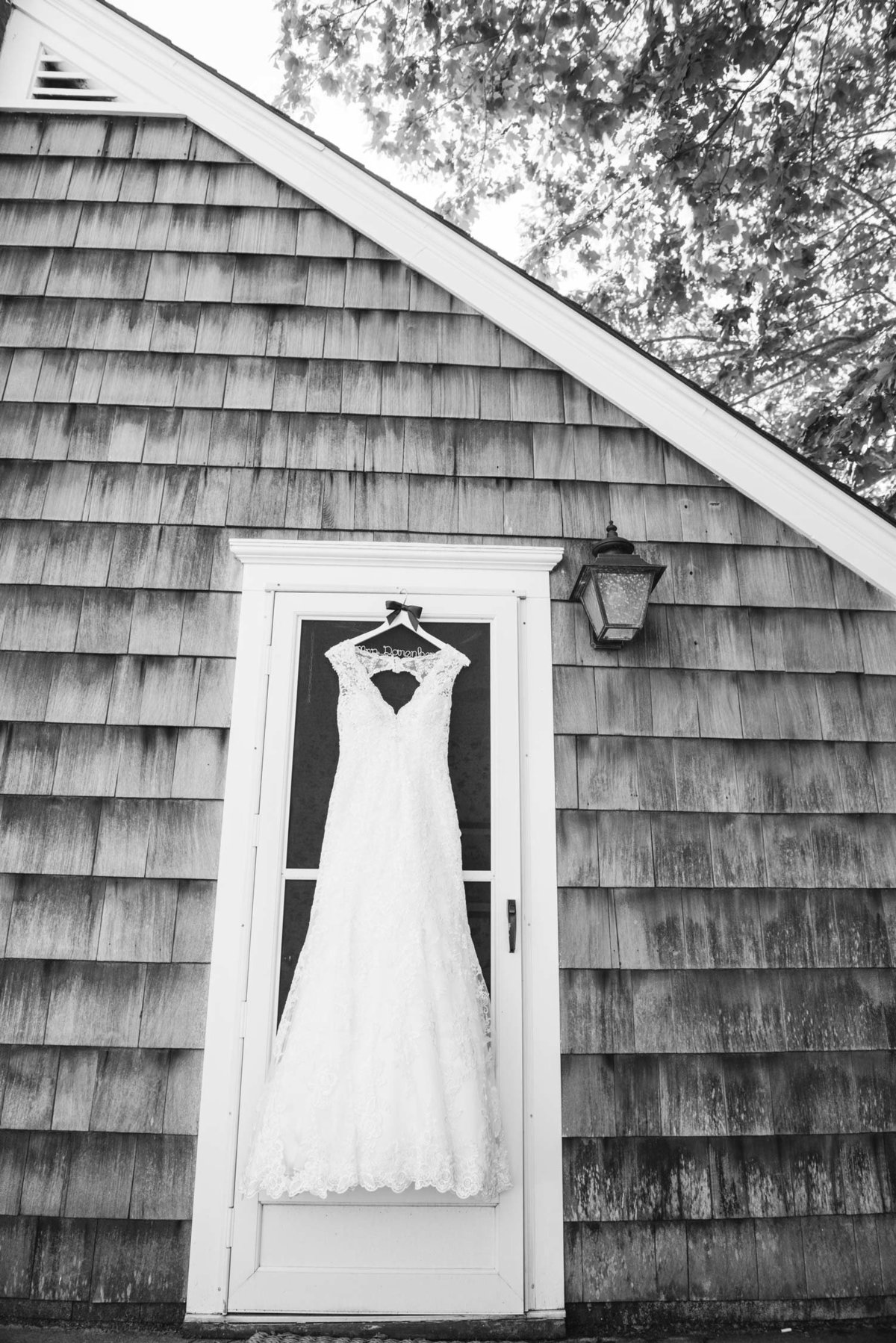 Bride's dress hanging on doorway at The Ram's Head Inn