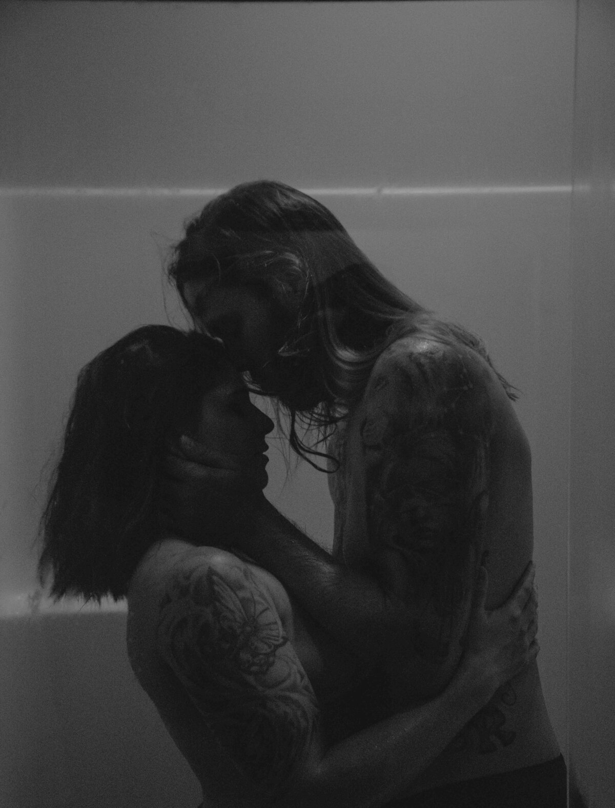 Couple holding eachother in the shower