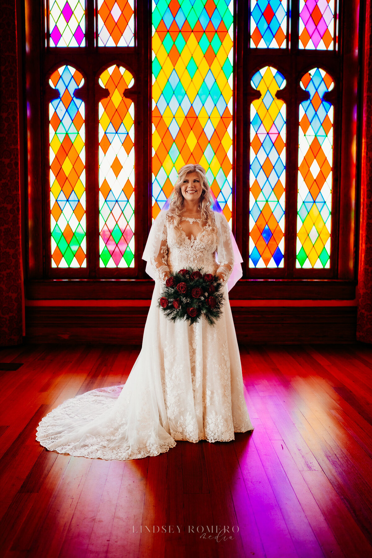 bridal photo with lace dress and stained glass at old state capital in baton rouge, la