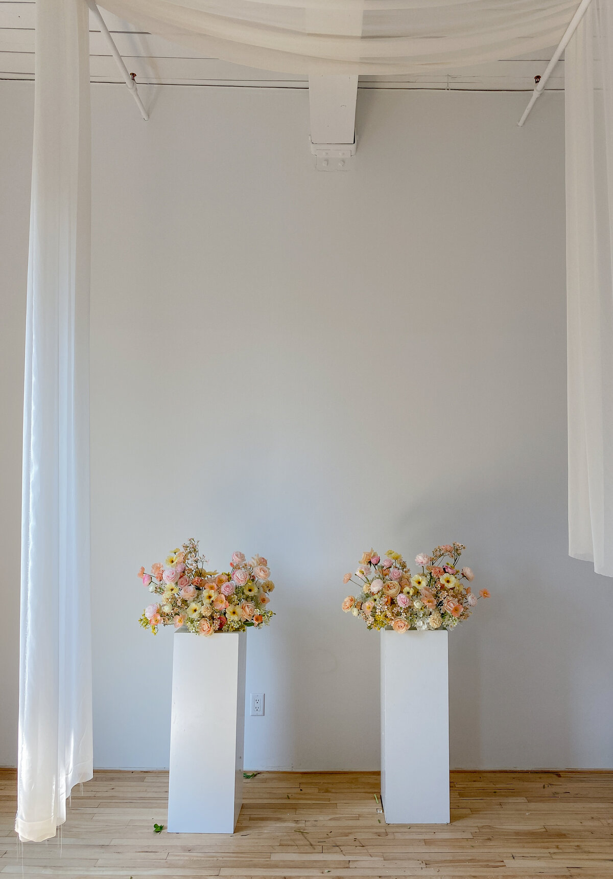 two whimsical florist wedding installations with artificial flowers