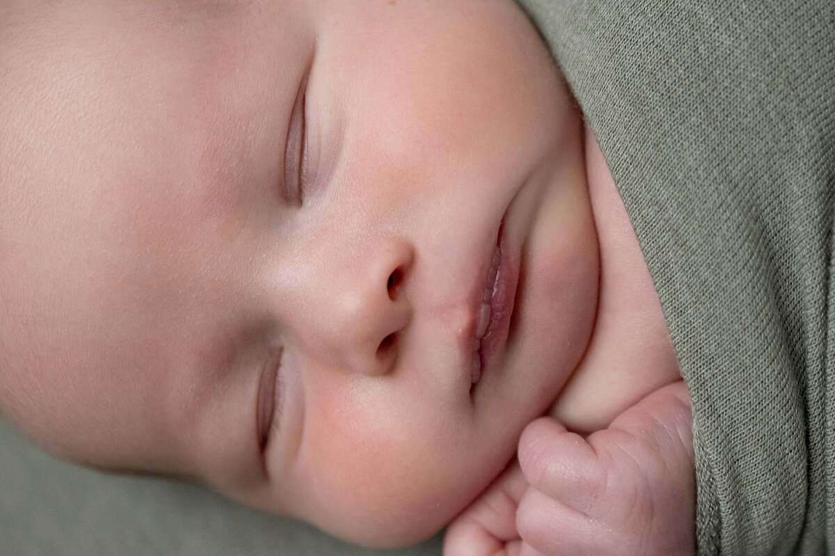 A closeup of a newborn baby sleeping face