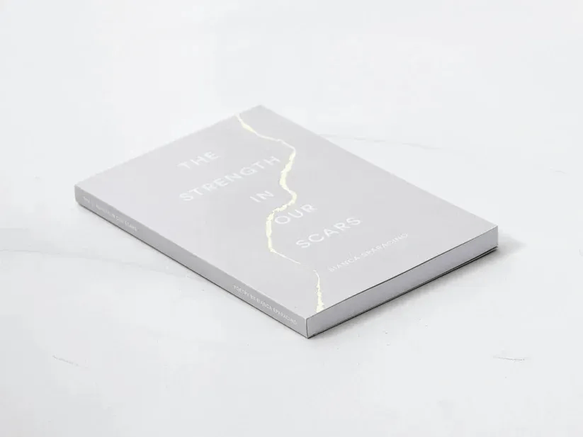 Peak Interactive Wellness recommended book The Strength in Our Scars by Bianca Sparacino, available in Denver and Greenwood Village to encourage healing and self-reflection.
