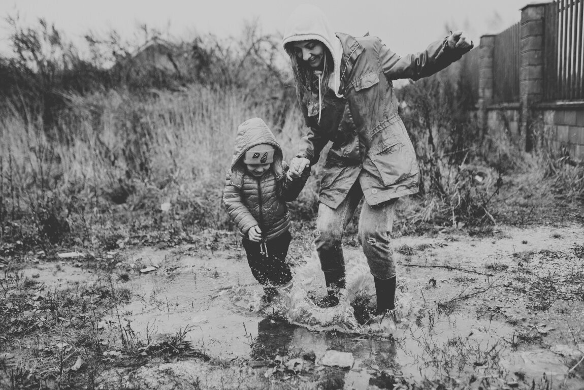 BW_A Woman Playing on the Rain with Her Child
