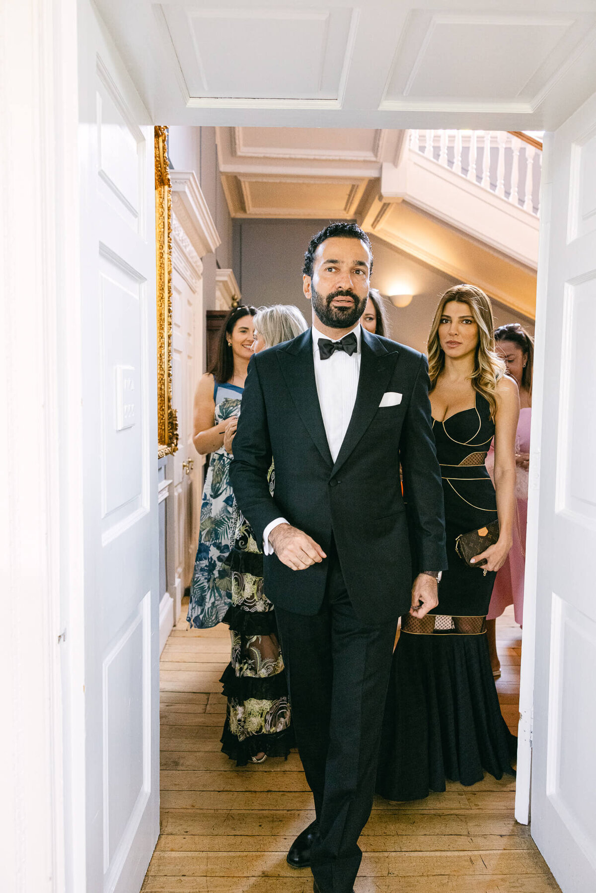 A wedding photo of guests entering the reception at Luttrellstown Castle in Ireland