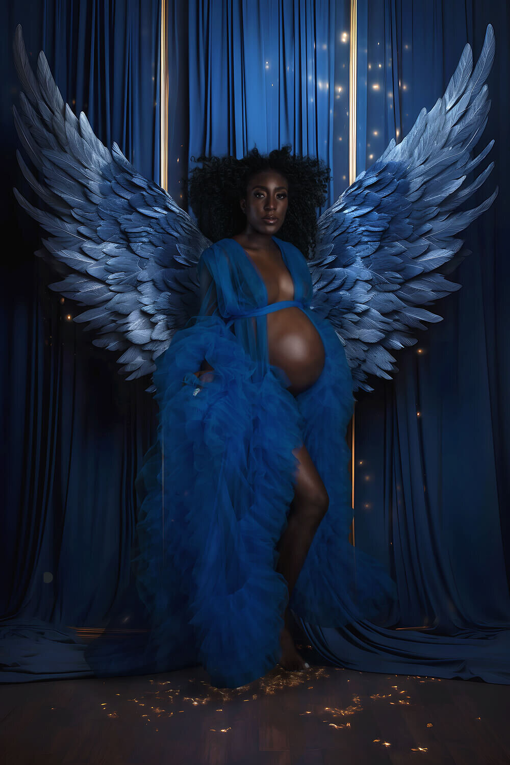 Pregnant mom wearing blue angel wings