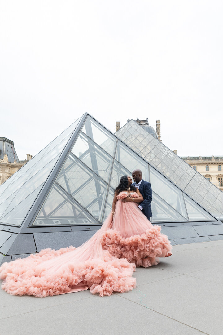 Louvre pyramids couple photoshoot, light pink princess dress, Paris photography session